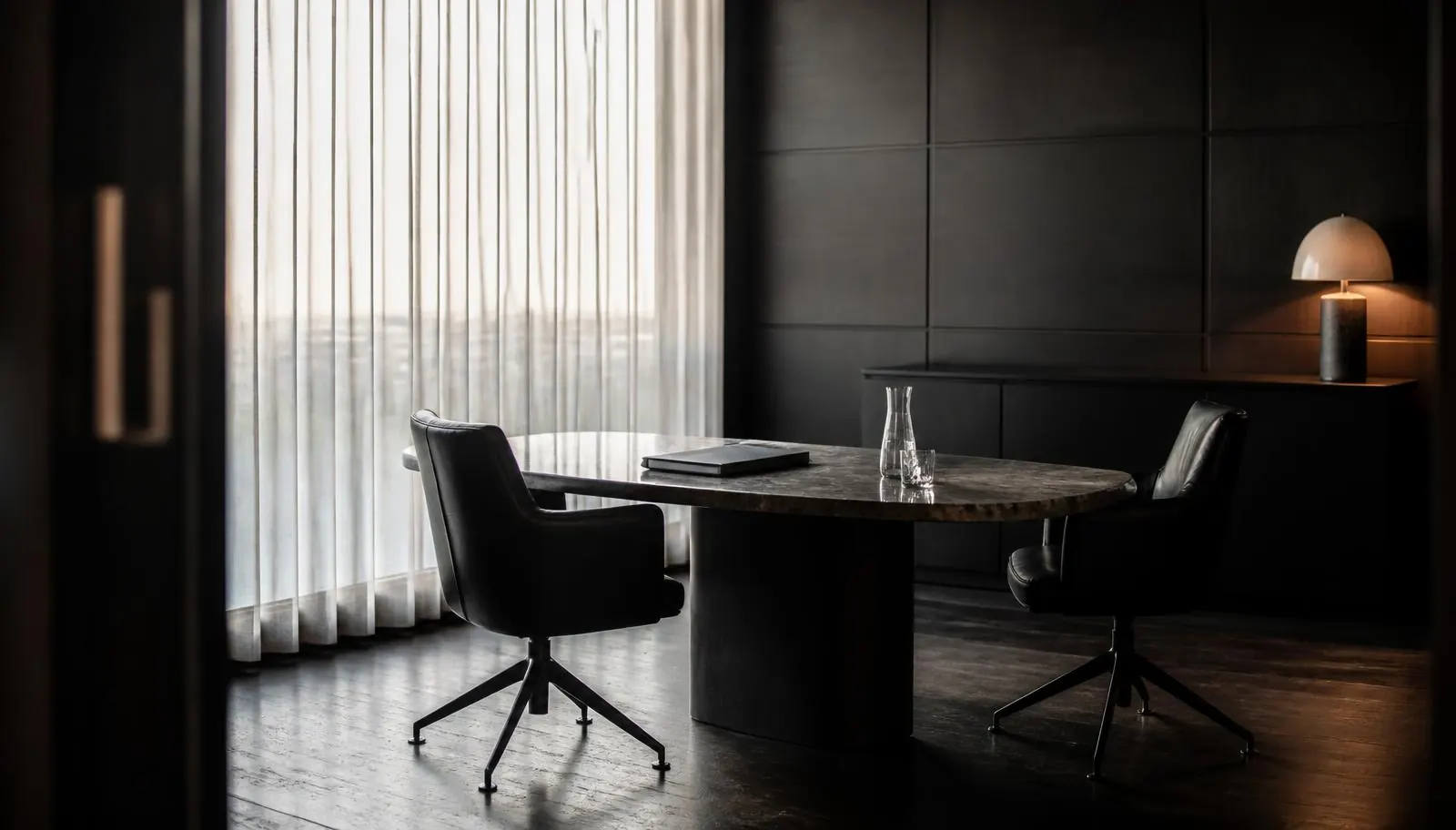 Private consultation office with leather chairs and a dark table set for a New Jersey cannabis accounting meeting